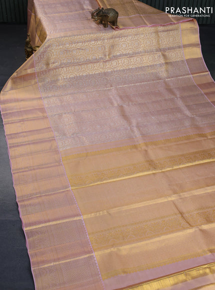 Kanchipuram tissue silk saree dual shade of mild peach with allover silver zari woven brocade weaves and long zari woven border