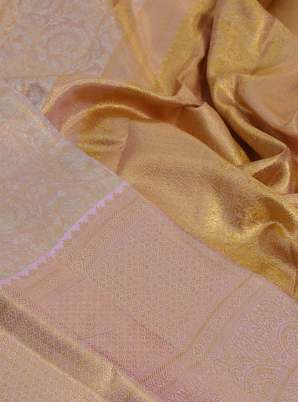 Kanchipuram tissue silk saree dual shade of mild peach with allover silver zari woven brocade weaves and long zari woven border