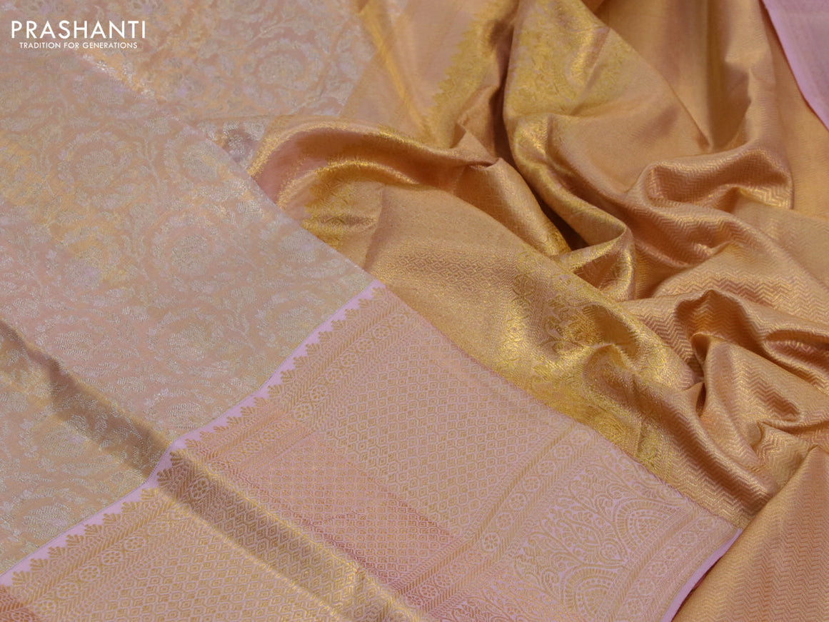 Kanchipuram tissue silk saree dual shade of mild peach with allover silver zari woven brocade weaves and long zari woven border