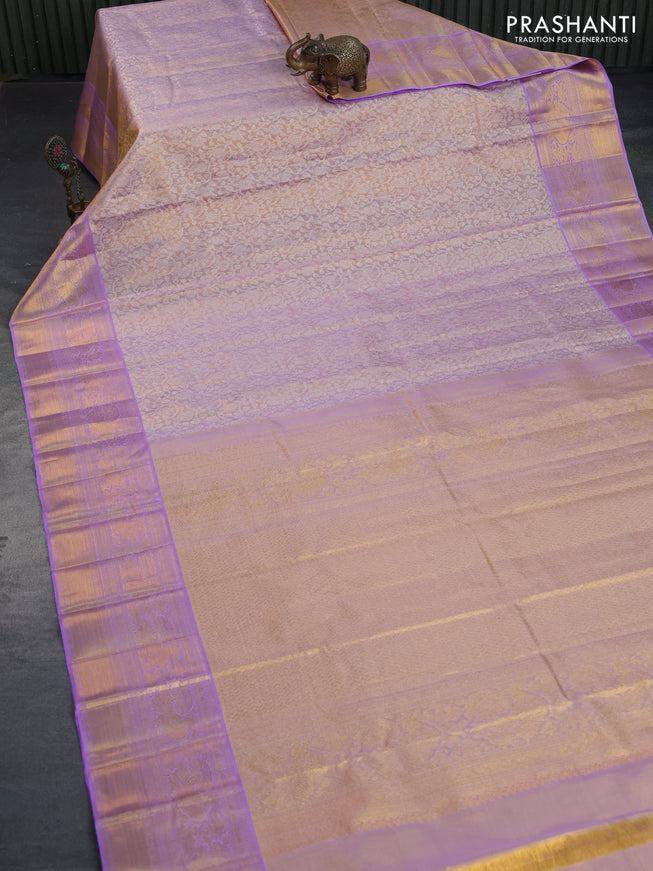 Kanchipuram tissue silk saree dual shade of mild lavender and lavender with allover silver zari woven brocade weaves and long zari woven border