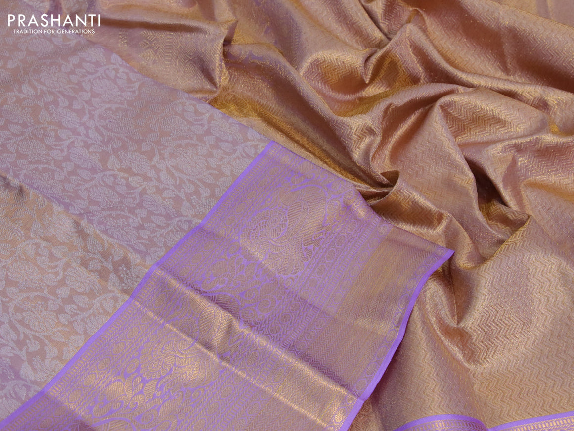 Kanchipuram tissue silk saree dual shade of mild lavender and lavender with allover silver zari woven brocade weaves and long zari woven border