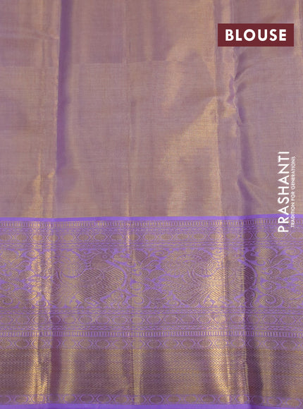 Kanchipuram tissue silk saree dual shade of mild lavender and lavender with allover silver zari woven brocade weaves and long zari woven border