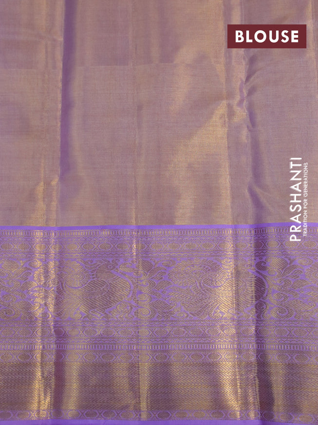 Kanchipuram tissue silk saree dual shade of mild lavender and lavender with allover silver zari woven brocade weaves and long zari woven border