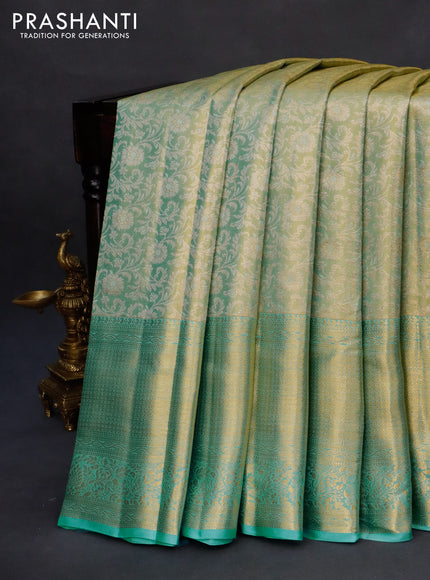 Kanchipuram tissue silk saree dual shade of teal blue with allover silver zari woven brocade weaves and long zari woven border