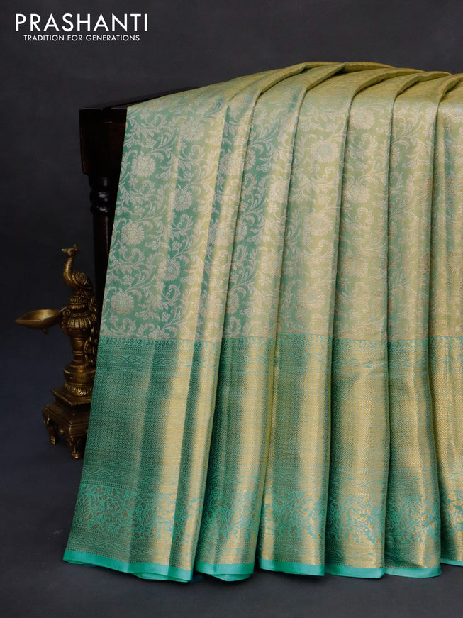 Kanchipuram tissue silk saree dual shade of teal blue with allover silver zari woven brocade weaves and long zari woven border