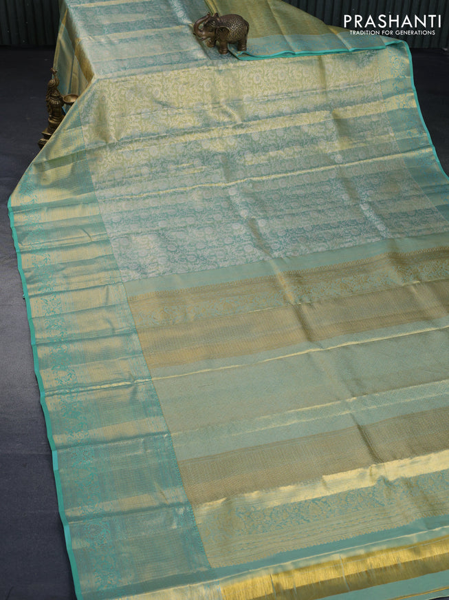 Kanchipuram tissue silk saree dual shade of teal blue with allover silver zari woven brocade weaves and long zari woven border