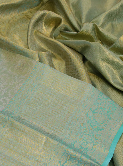 Kanchipuram tissue silk saree dual shade of teal blue with allover silver zari woven brocade weaves and long zari woven border