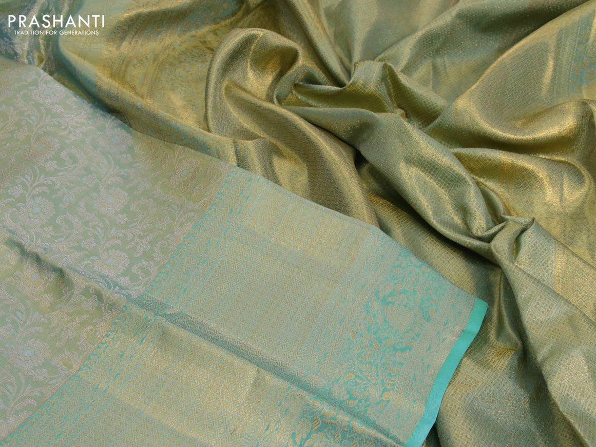 Kanchipuram tissue silk saree dual shade of teal blue with allover silver zari woven brocade weaves and long zari woven border