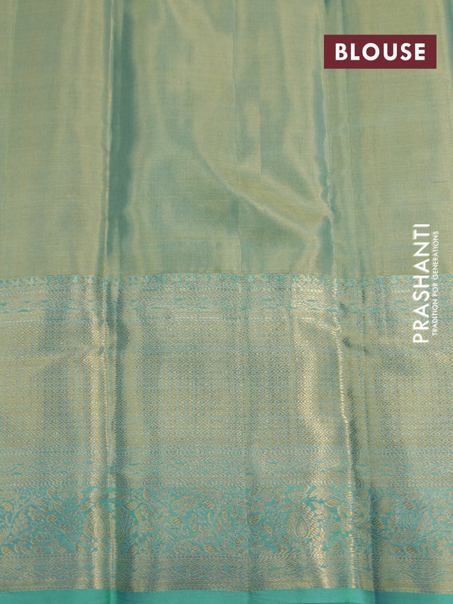 Kanchipuram tissue silk saree dual shade of teal blue with allover silver zari woven brocade weaves and long zari woven border