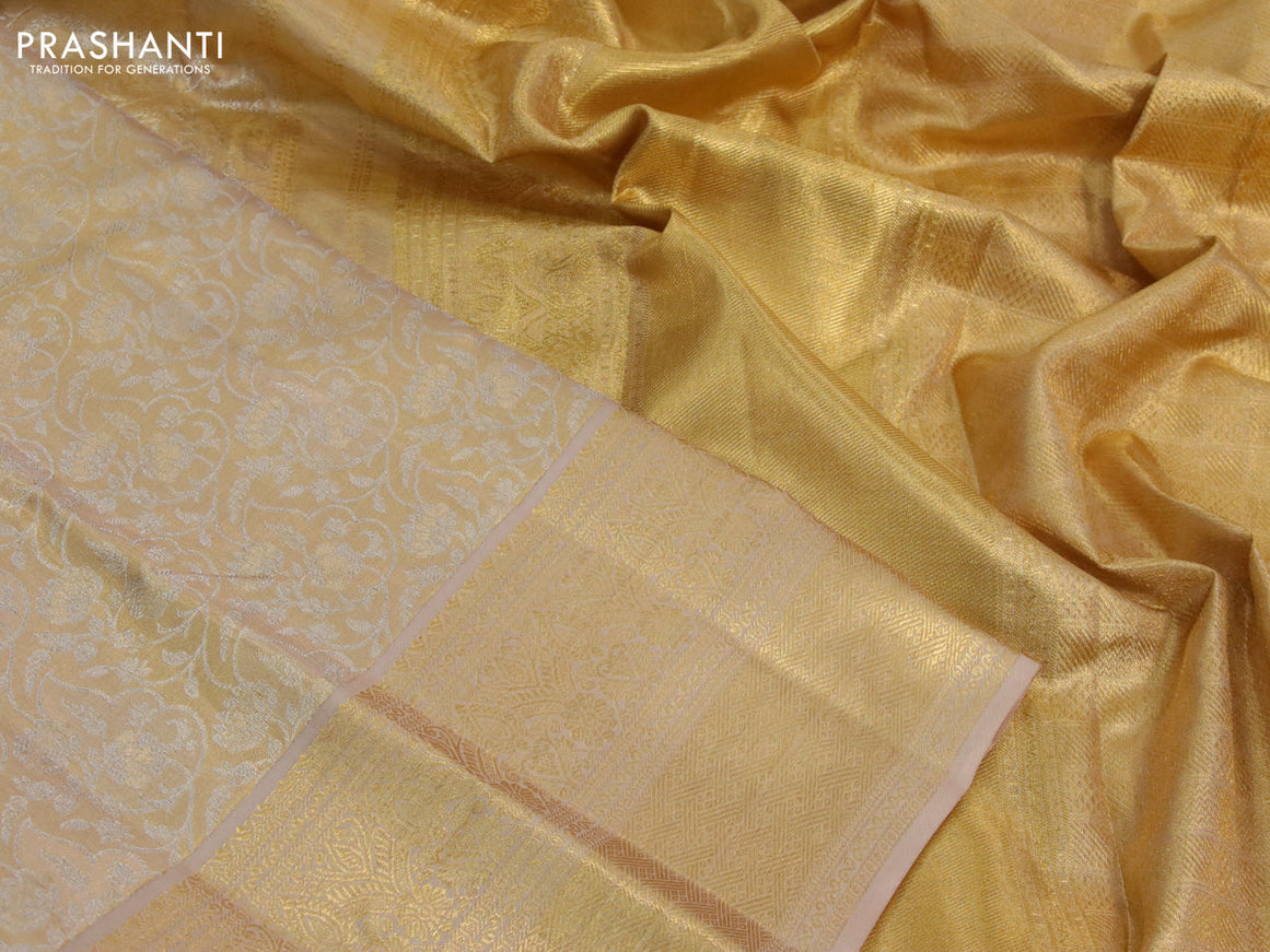 Kanchipuram tissue silk saree gold and dark sandal with allover silver zari woven brocade weaves and long zari woven border