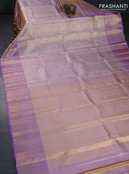 Kanchipuram tissue silk saree dual shade of gold and lavender shade with allover zari woven brocade weaves and long zari woven border