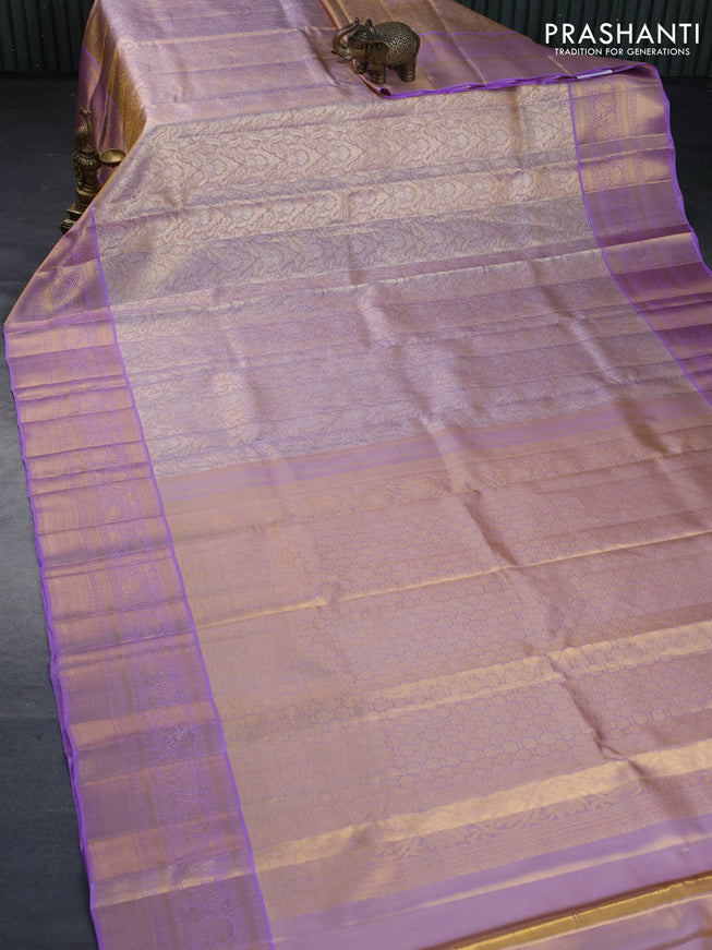 Kanchipuram tissue silk saree dual shade of gold and lavender shade with allover zari woven brocade weaves and long zari woven border