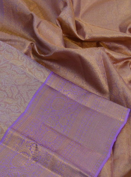 Kanchipuram tissue silk saree dual shade of gold and lavender shade with allover zari woven brocade weaves and long zari woven border