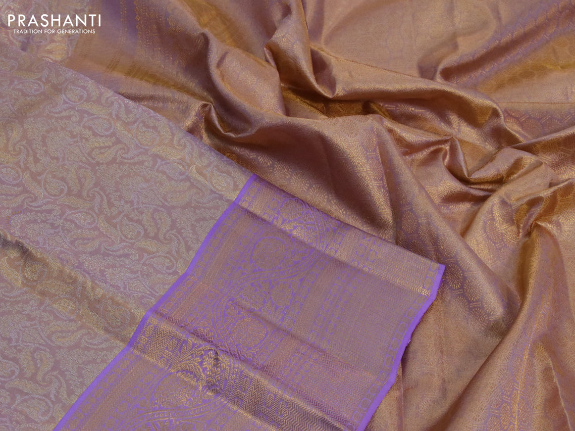 Kanchipuram tissue silk saree dual shade of gold and lavender shade with allover zari woven brocade weaves and long zari woven border