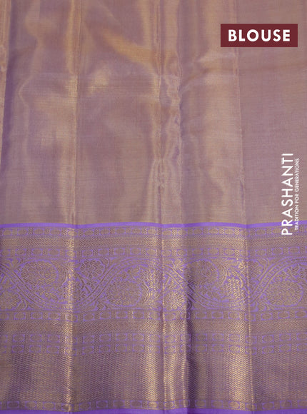 Kanchipuram tissue silk saree dual shade of gold and lavender shade with allover zari woven brocade weaves and long zari woven border