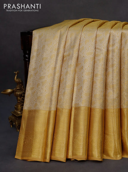 Kanchipuram tissue silk saree gold with allover silver zari woven brocade weaves and long zari woven border