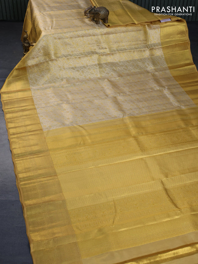 Kanchipuram tissue silk saree gold with allover silver zari woven brocade weaves and long zari woven border