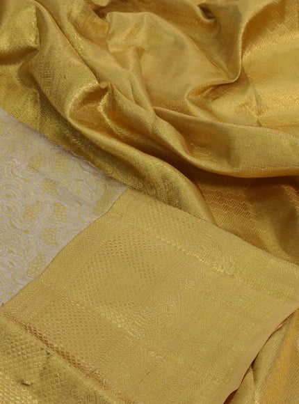 Kanchipuram tissue silk saree gold with allover silver zari woven brocade weaves and long zari woven border