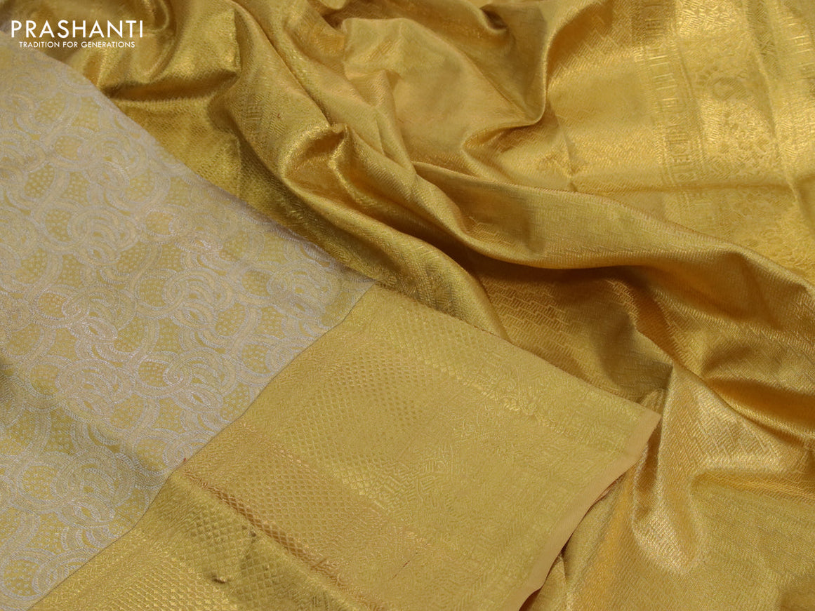 Kanchipuram tissue silk saree gold with allover silver zari woven brocade weaves and long zari woven border