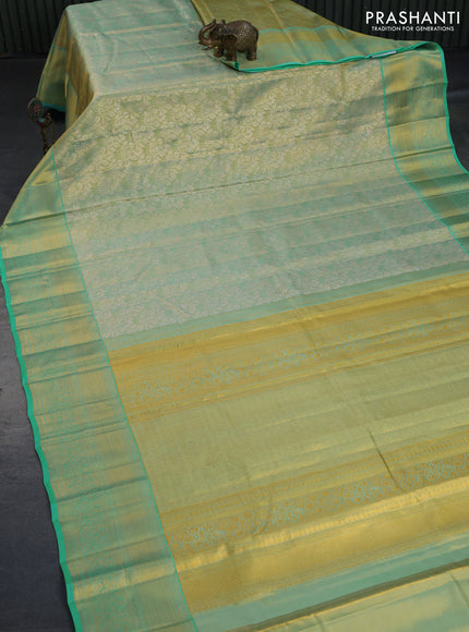 Kanchipuram tissue silk saree dual shade of teal blue with allover silver zari woven brocade weaves and long zari woven border