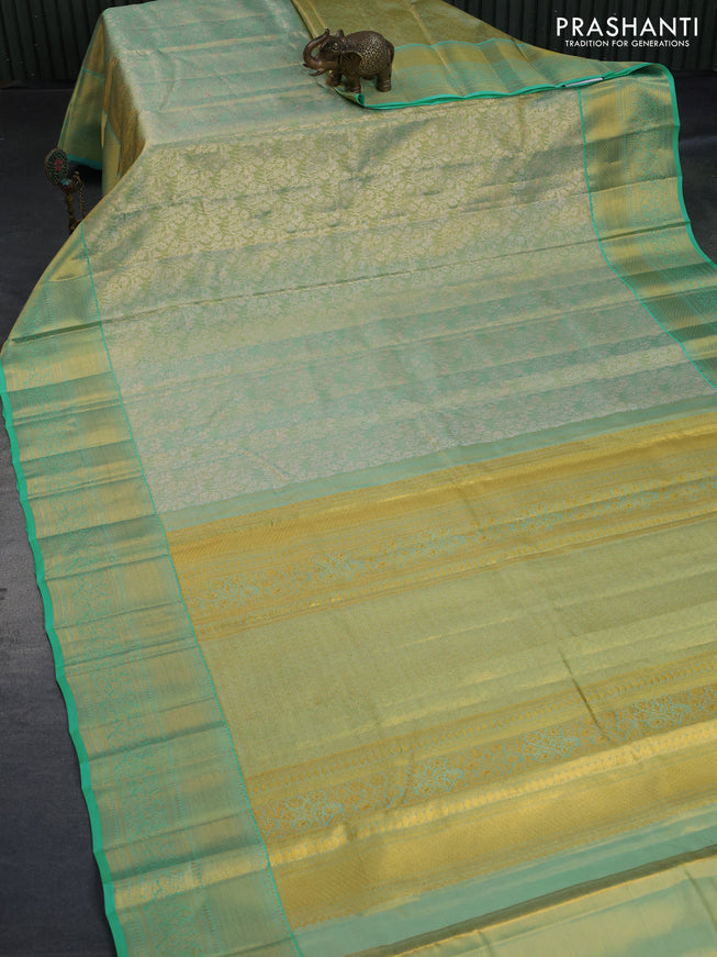 Kanchipuram tissue silk saree dual shade of teal blue with allover silver zari woven brocade weaves and long zari woven border