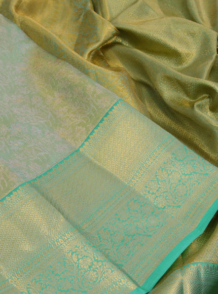 Kanchipuram tissue silk saree dual shade of teal blue with allover silver zari woven brocade weaves and long zari woven border