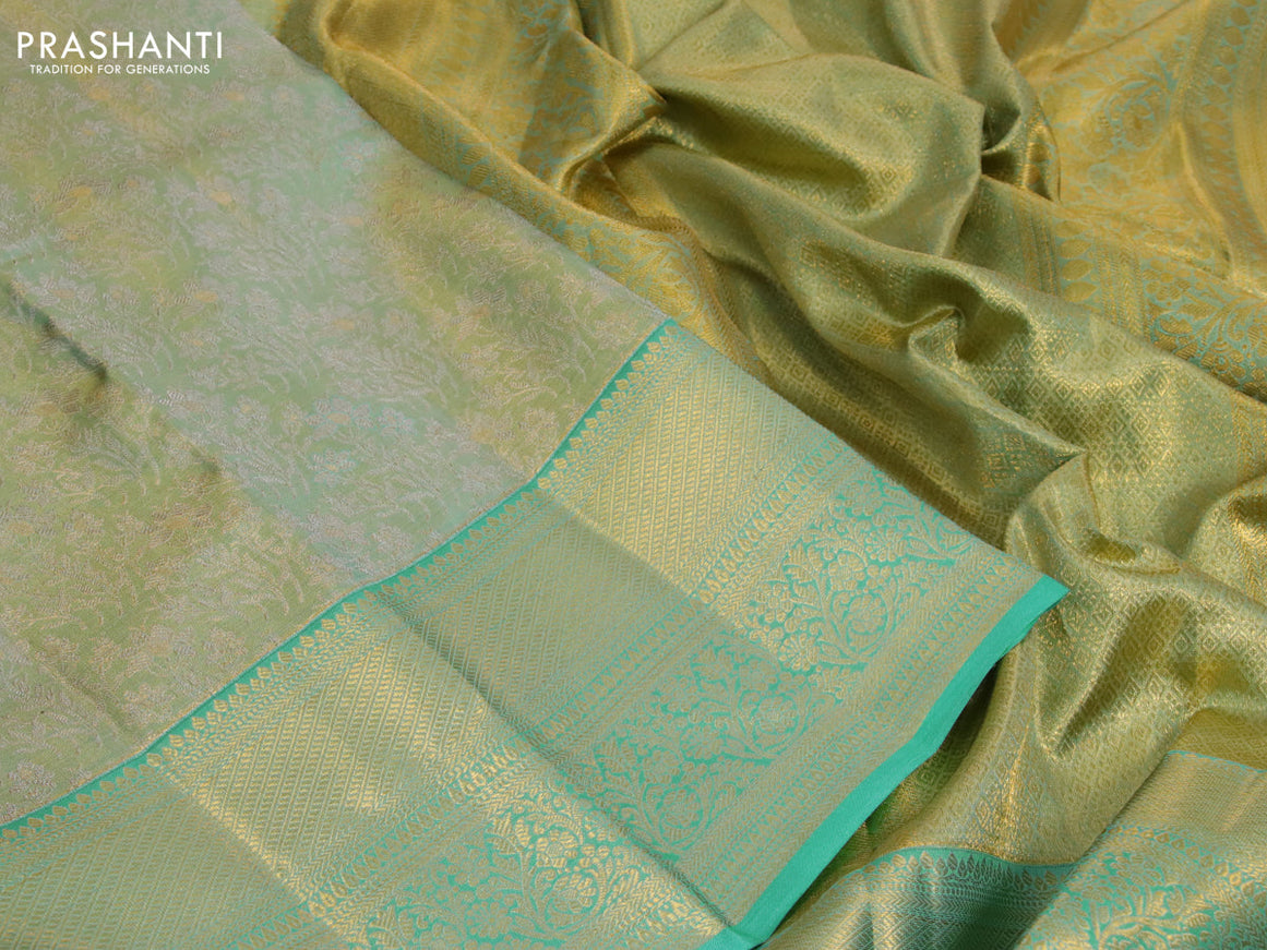 Kanchipuram tissue silk saree dual shade of teal blue with allover silver zari woven brocade weaves and long zari woven border