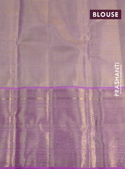 Kanchipuram tissue silk saree dual shade of gold and light pink with allover zari woven brocade weaves and long zari woven border