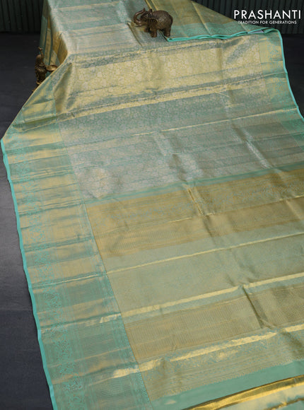 Kanchipuram tissue silk saree dual shade of teal blue with allover zari woven brocade weaves and long zari woven border