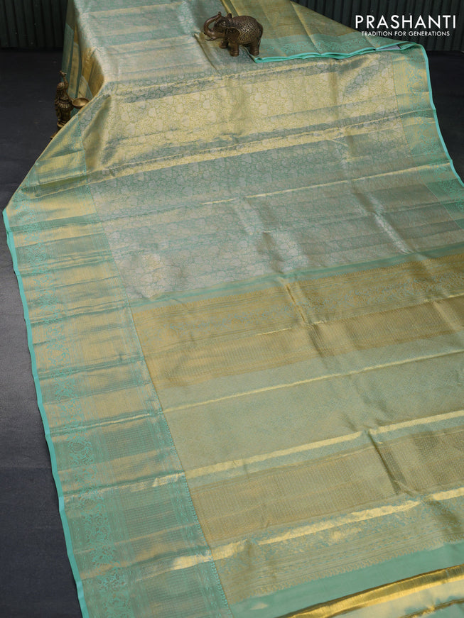 Kanchipuram tissue silk saree dual shade of teal blue with allover zari woven brocade weaves and long zari woven border