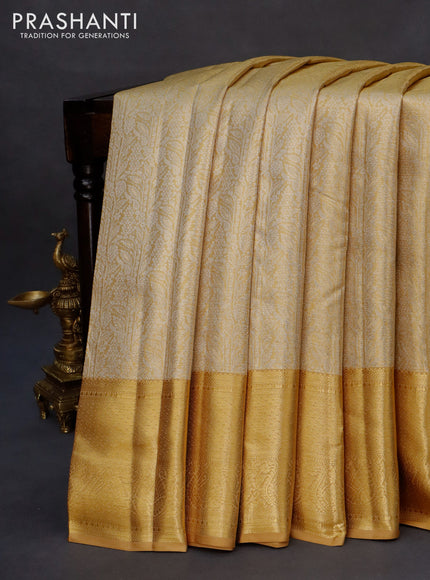 Kanchipuram tissue silk saree gold with allover silver zari woven brocade weaves and zari woven border