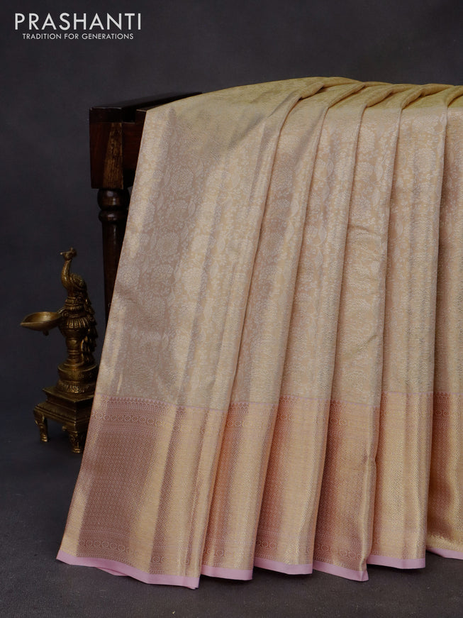 Kanchipuram tissue silk saree cream and light pink with allover silver zari woven brocade weaves and zari woven border