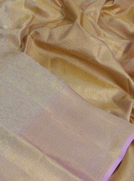 Kanchipuram tissue silk saree cream and light pink with allover silver zari woven brocade weaves and zari woven border