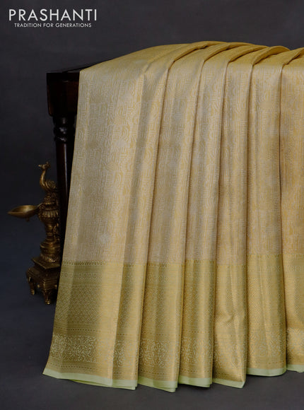 Kanchipuram tissue silk saree gold and pista green with allover zari woven brocade weaves and long zari woven border