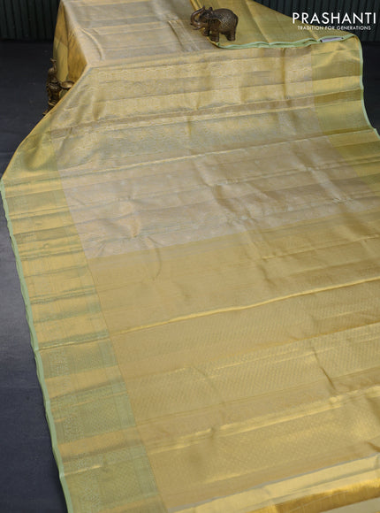 Kanchipuram tissue silk saree gold and pista green with allover zari woven brocade weaves and long zari woven border