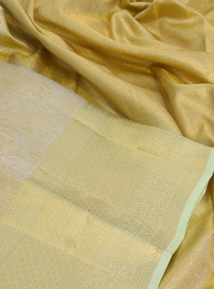 Kanchipuram tissue silk saree gold and pista green with allover zari woven brocade weaves and long zari woven border