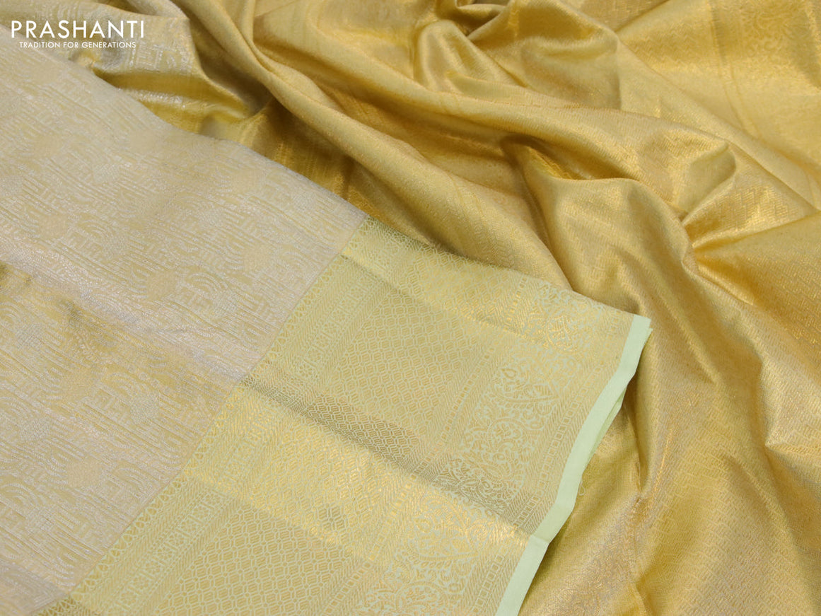 Kanchipuram tissue silk saree gold and pista green with allover zari woven brocade weaves and long zari woven border