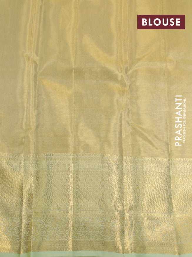 Kanchipuram tissue silk saree gold and pista green with allover zari woven brocade weaves and long zari woven border