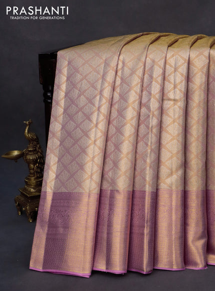 Kanchipuram tissue silk saree dual shade of peach and light pink with allover silver zari woven geometric brocade weaves and long zari woven border