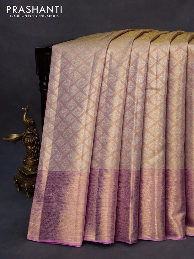 Kanchipuram tissue silk saree dual shade of peach and light pink with allover silver zari woven geometric brocade weaves and long zari woven border