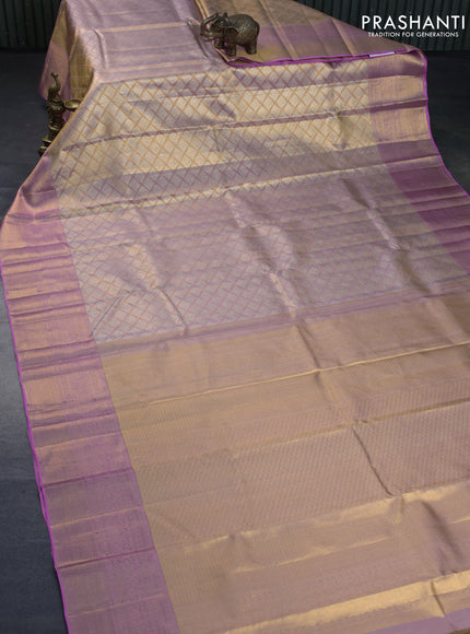 Kanchipuram tissue silk saree dual shade of peach and light pink with allover silver zari woven geometric brocade weaves and long zari woven border