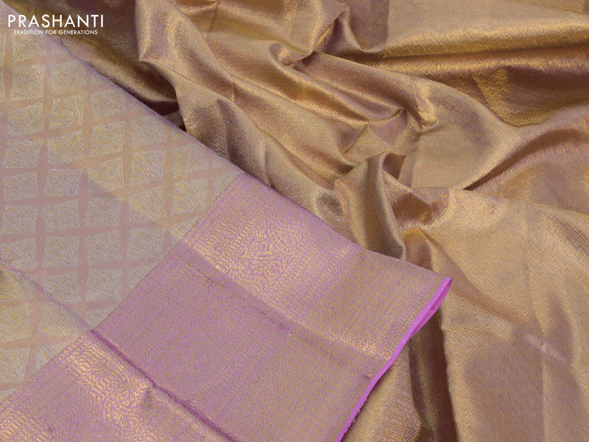 Kanchipuram tissue silk saree dual shade of peach and light pink with allover silver zari woven geometric brocade weaves and long zari woven border