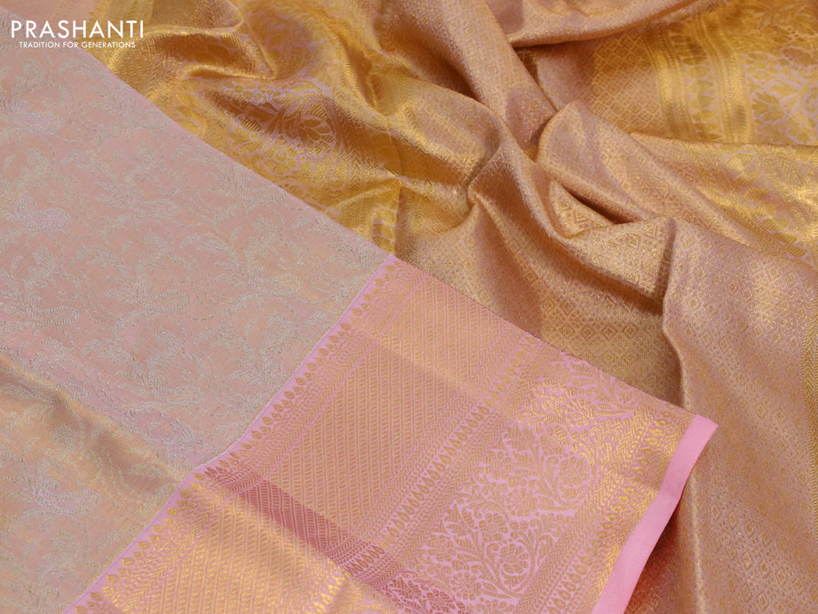 Kanchipuram tissue silk saree dual shade of peach and peach pink with allover silver zari woven brocade weaves and long zari woven border