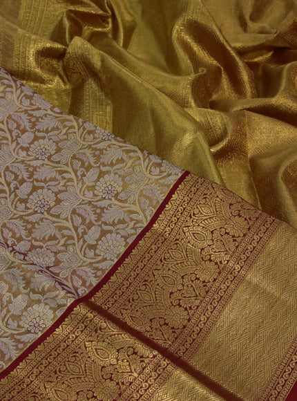 Kanchipuram tissue silk saree dual shade of reddish gold and red with allover zari woven brocade weaves and long zari woven border