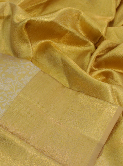 Kanchipuram tissue silk saree gold with allover silver zari woven brocade weaves and zari woven border