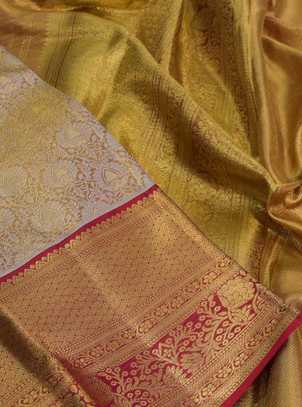 Kanchipuram tissue silk saree dual shade of gold and red with allover silver zari woven brocade weaves and zari woven border