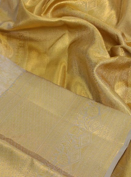 Kanchipuram tissue silk saree gold and beige with allover silver zari woven brocade weaves and zari woven border