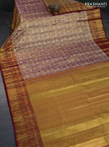 Kanchipuram tissue silk saree dual shade of goldish red and red with allover silver zari woven floral brocade weaves and long zari woven border