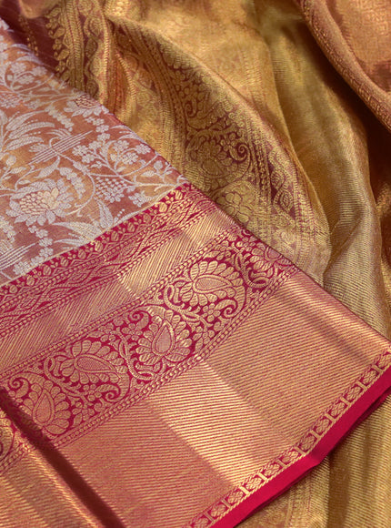 Kanchipuram tissue silk saree dual shade of goldish red and red with allover silver zari woven floral brocade weaves and long zari woven border