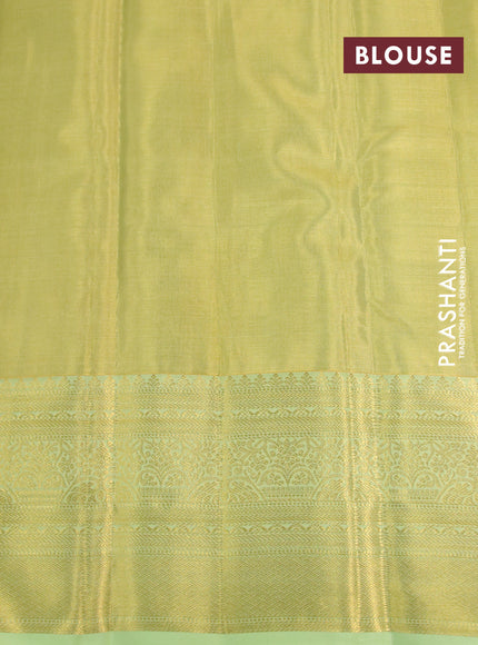 Kanchipuram tissue silk saree dual shade of lime yellow and pista green with allover zari woven brocade weaves and long zari woven border